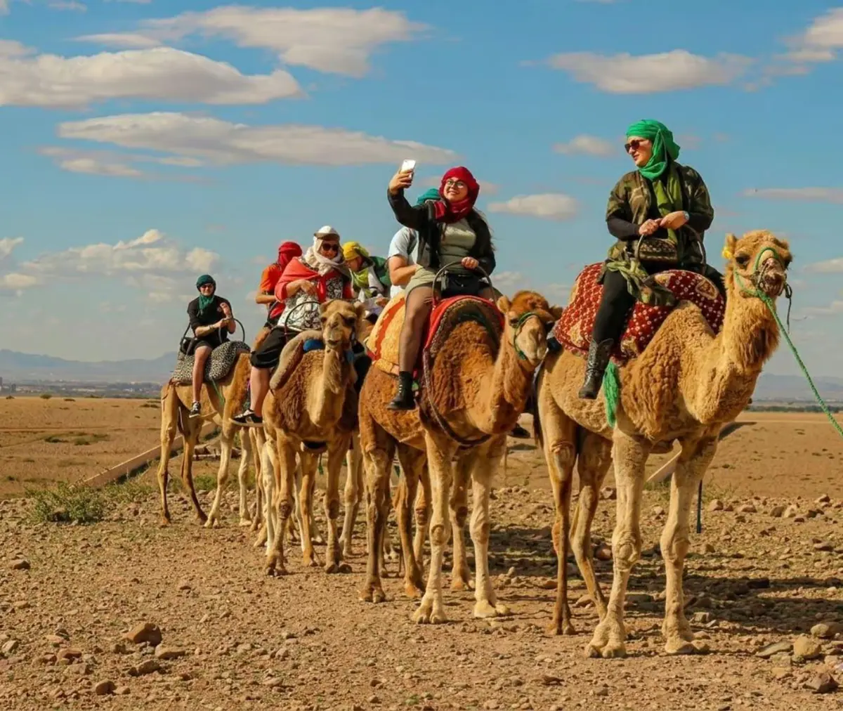 Camel caravan with travellers wearing Berber turbans