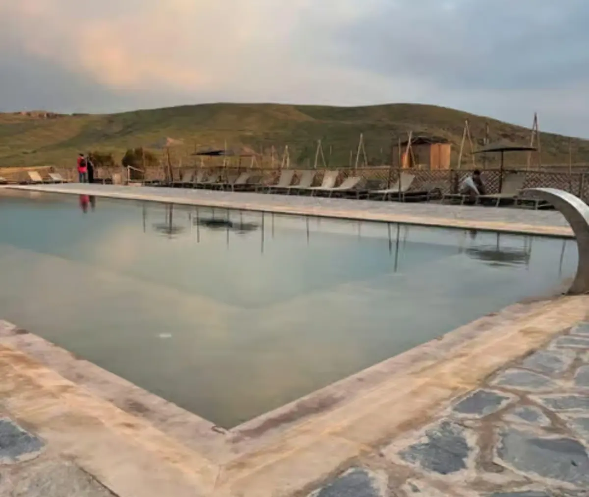 Calm pool at the camp in the evening light