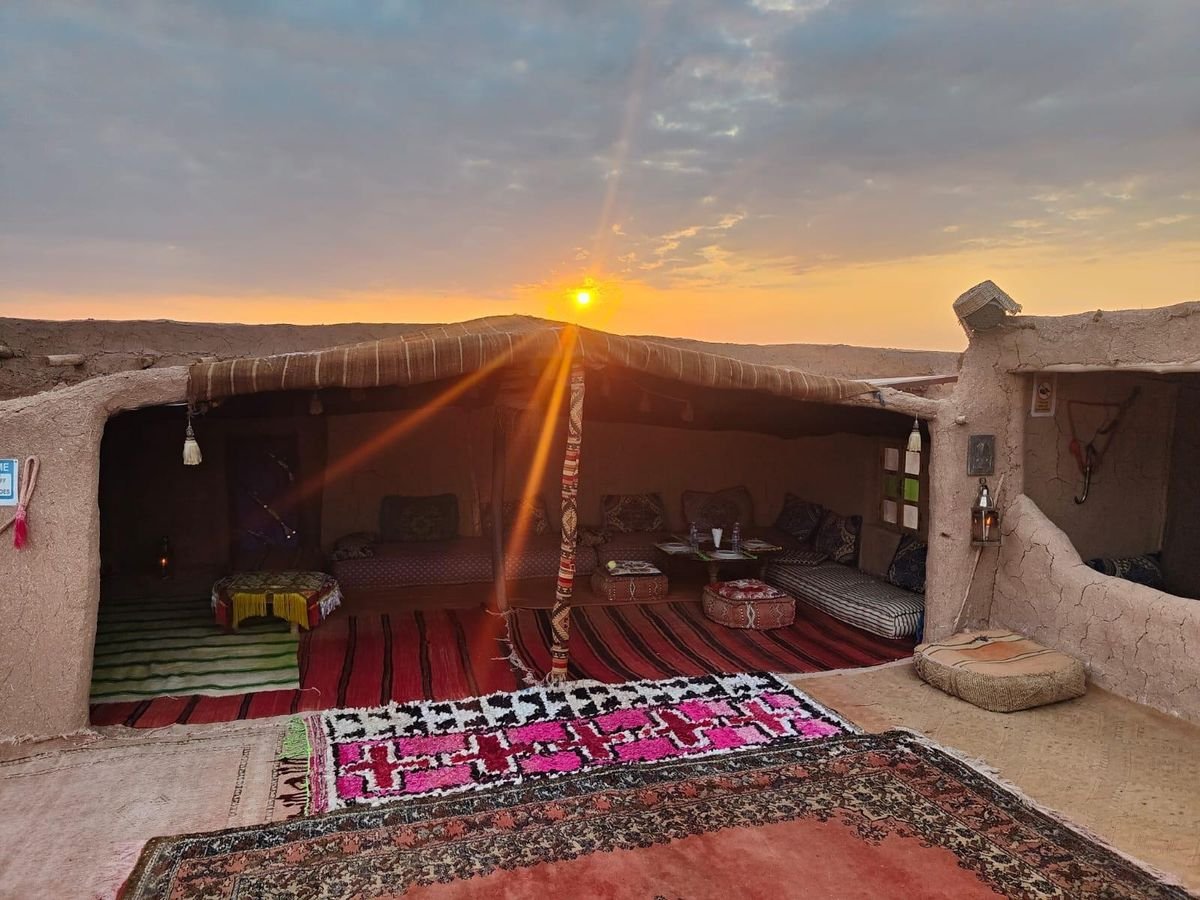 Berber tent with carpets at sunrise